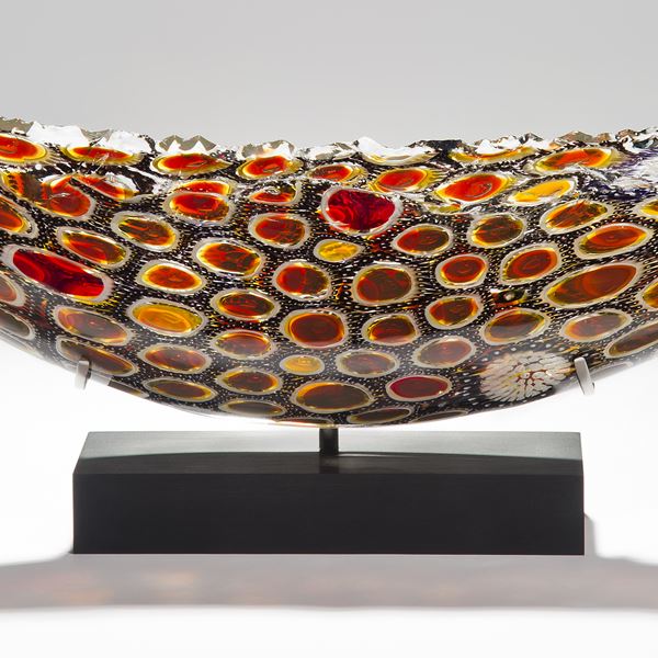 circular patterned handblown intricate glass sculpture in concave shape 