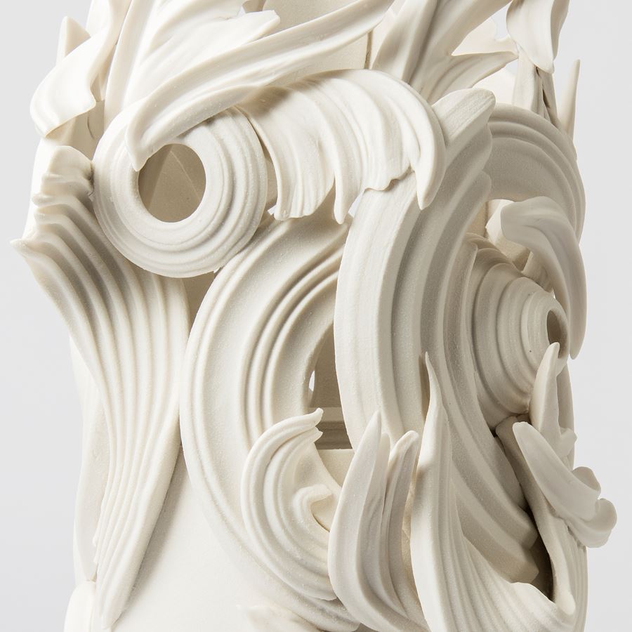 ceramic sculpture in grey of decorative swirls