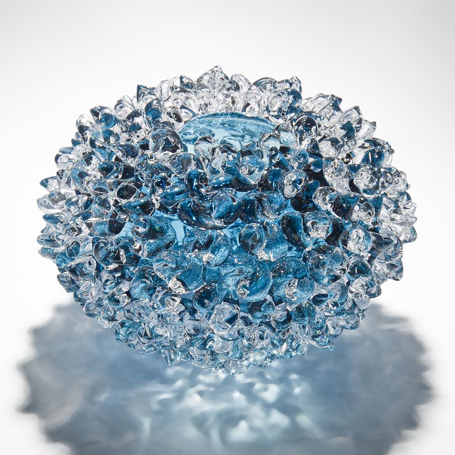 modern handblown art glass ornament of crystals in flower form in blue
