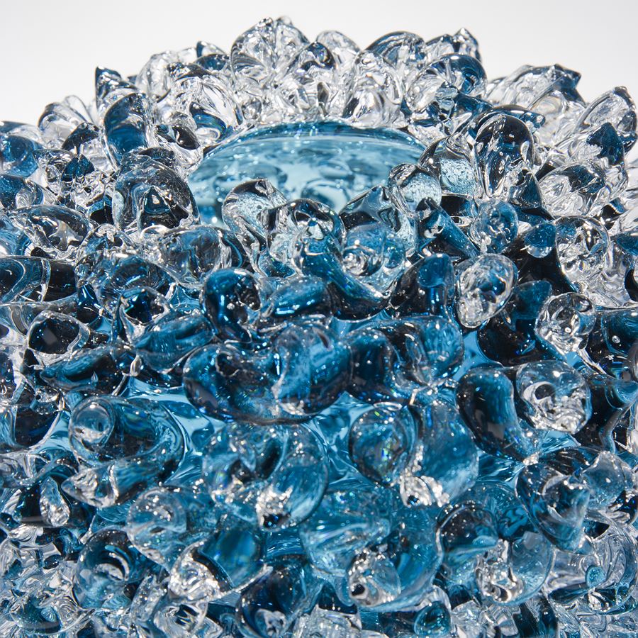 modern handblown art glass ornament of crystals in flower form in blue