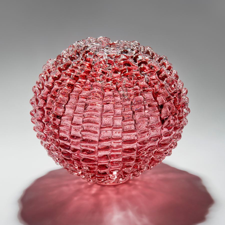 handblown spherical contemporary art glass sculpture in heliotrope arranged from small shards
