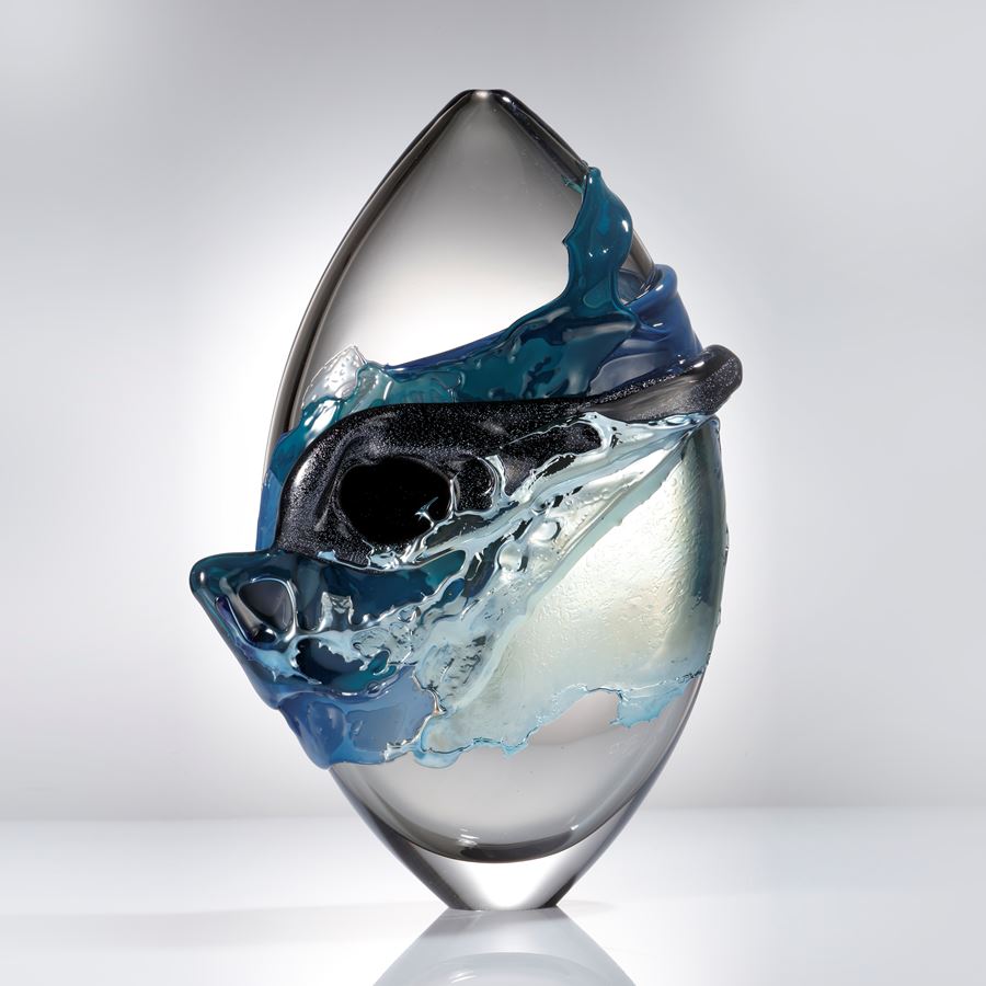 light blue and clear modern glass-art sculpture oval shaped