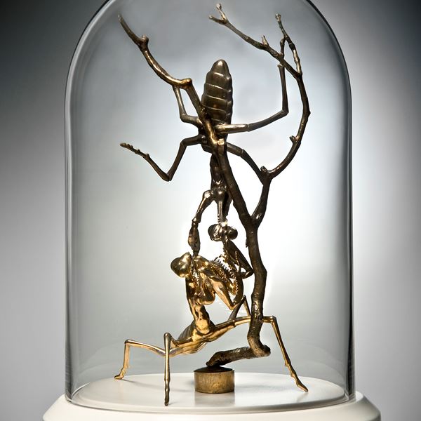 metal glass and porcelain sculpture of ants trapped in tall dome
