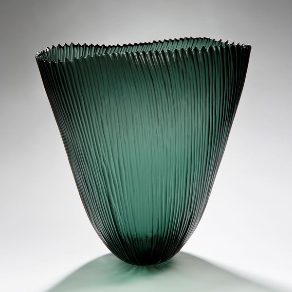 tall open sculpted green vessel with ribbed pattern