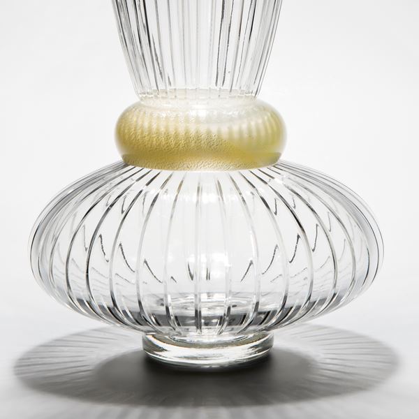 decorative clear glass vase sculpture with wide base and gold trim