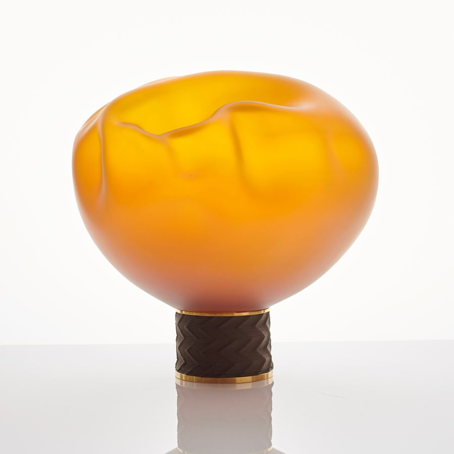 modern flower shaped art-glass sculpture in bright yellow and orange on brass base