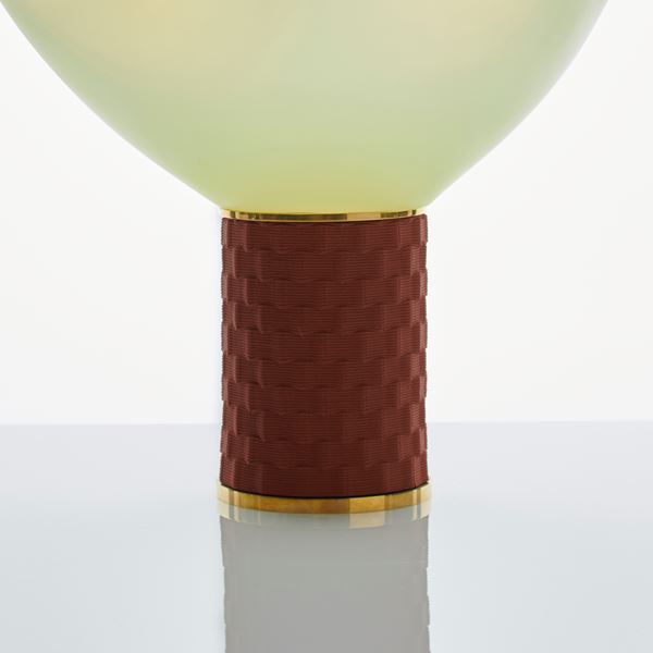 cream coloured art glass sculpture of blown glass blob with bronze base