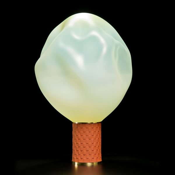 cream coloured art glass sculpture of blown glass blob with bronze base