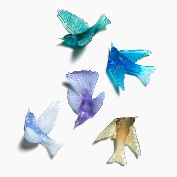 sculpted glass models of birds in various pastel colours
