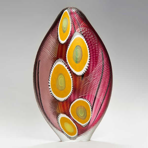 sculpted glass vase in bright colours with large yellow dots