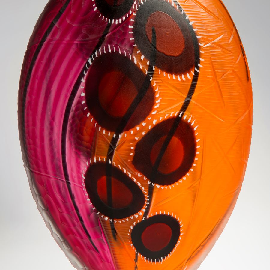 glass vase sculpture in orange and pink with blood red blobs