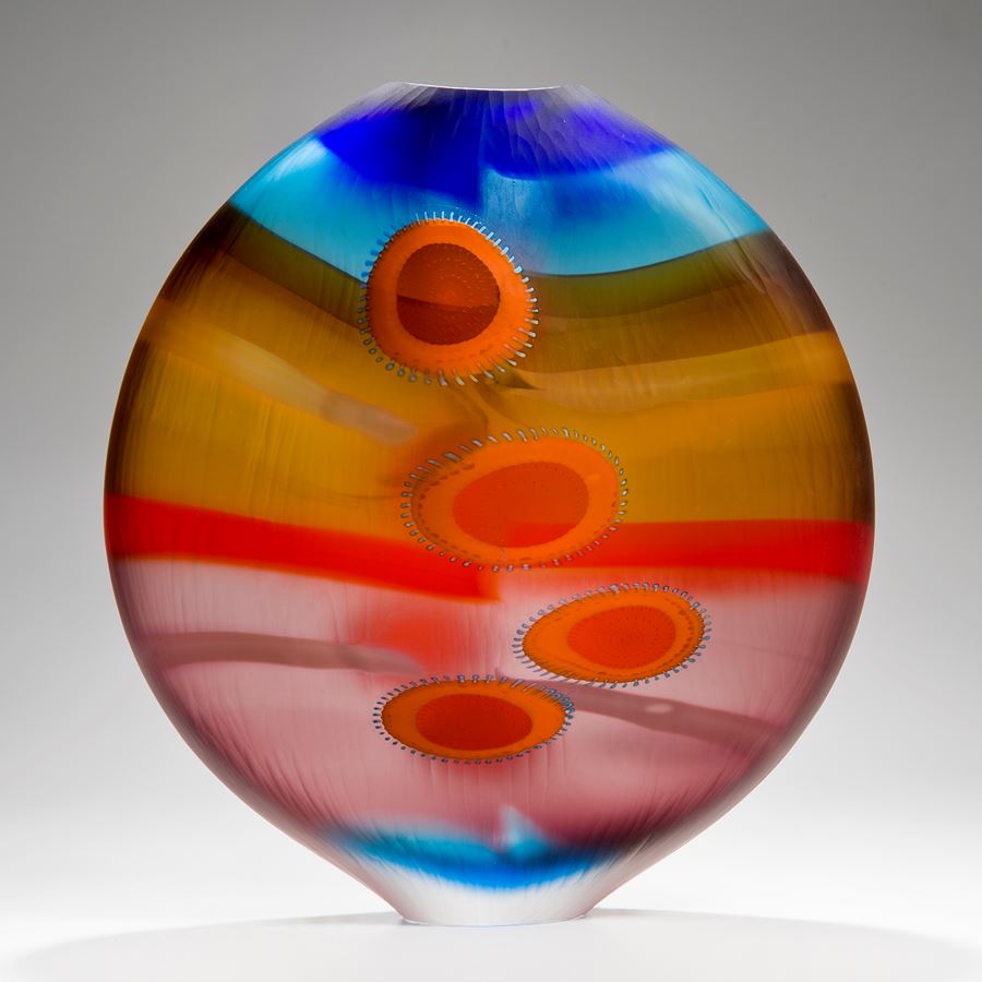 brightly coloured round glass vase with elliptical shapes