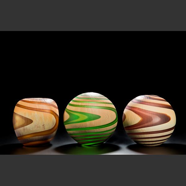 art glass vases in various shapes and colours with swirling colour