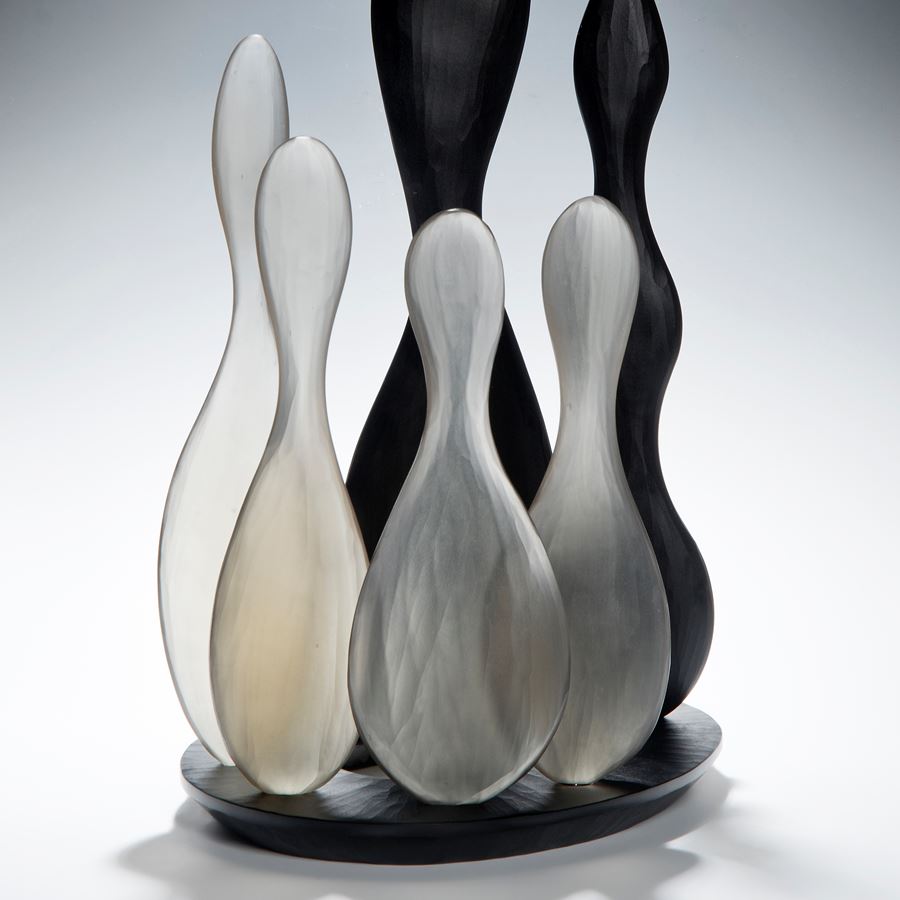still life art glass skittles in black and white glass on black base