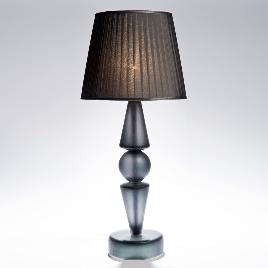 table lamp made from grey steel base and cut glass lampshade