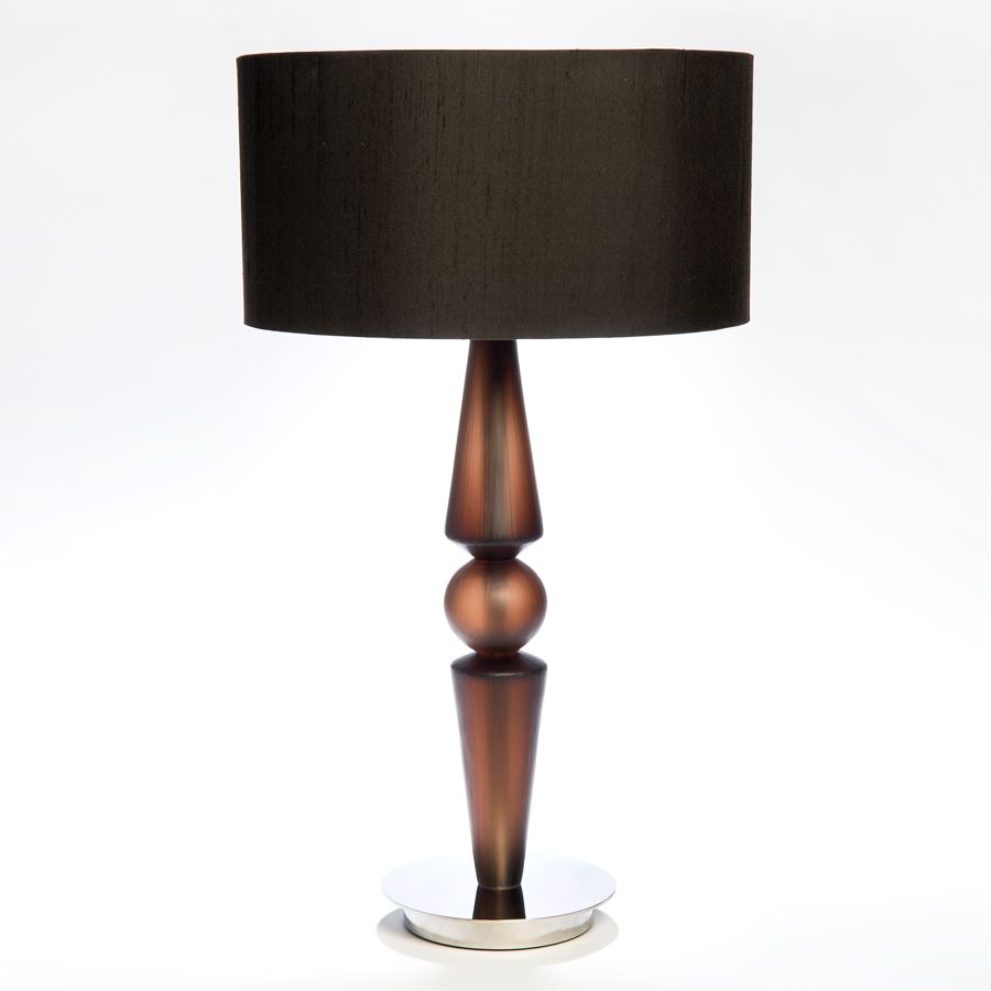 table lamp with gold steel base and black cut glass lampshade