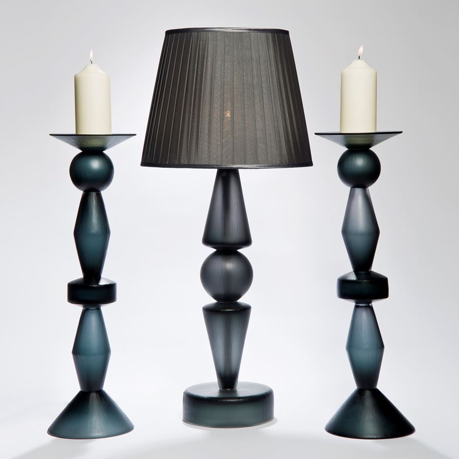 two art glass candlesticks in dark blue