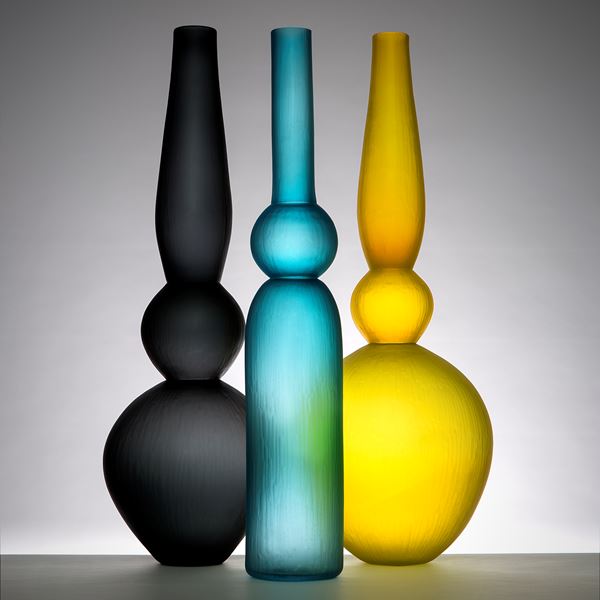 selection of tall minimalist blown glass vases in different colours