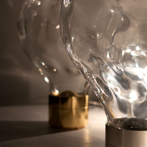 glass art moving lightbulb collection with brass base