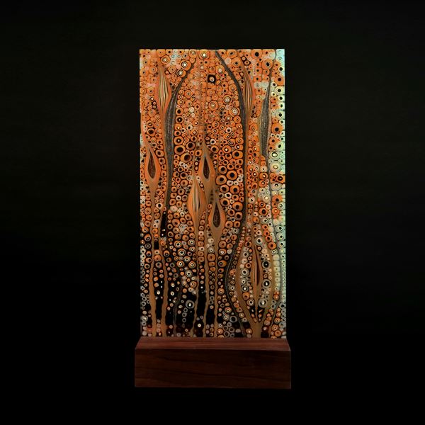 gold and brown panel handmade from glass with organic pattern and wooden base