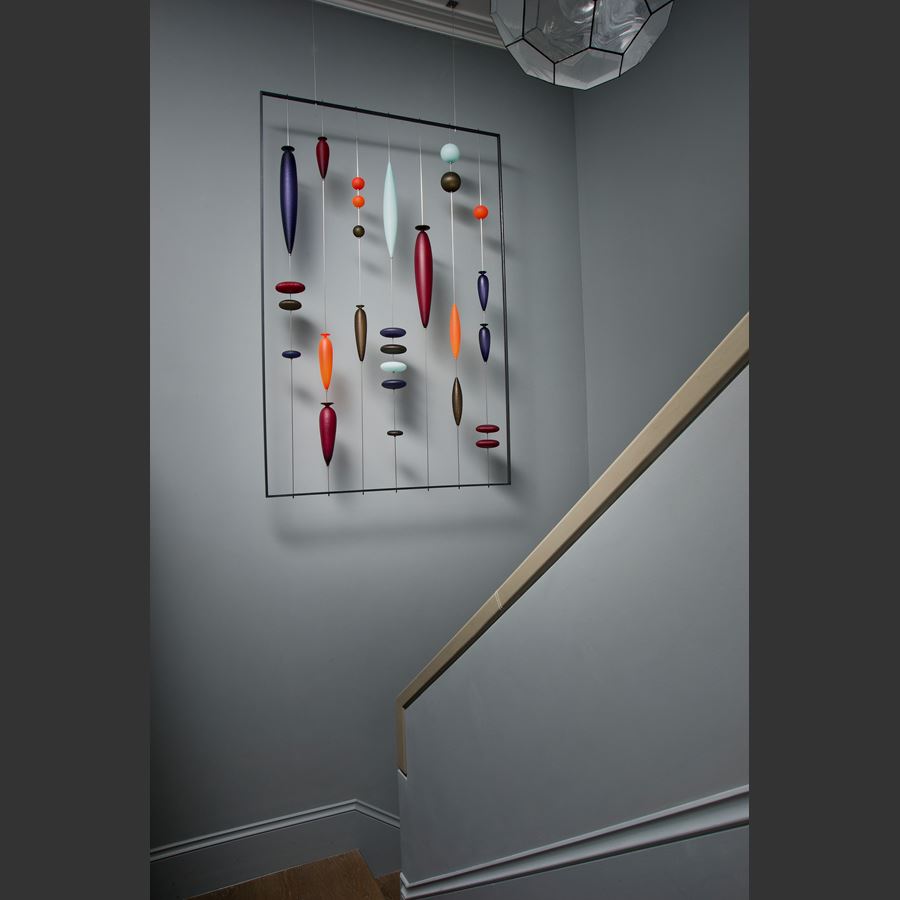 wall-mounted blown glass art sculpture with steel frame