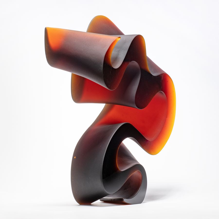abstract contemporary glass art sculpture in red and black