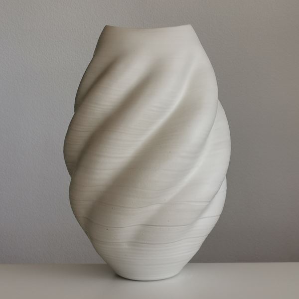 sculptured ceramic vessel vase in cream with ripple effect