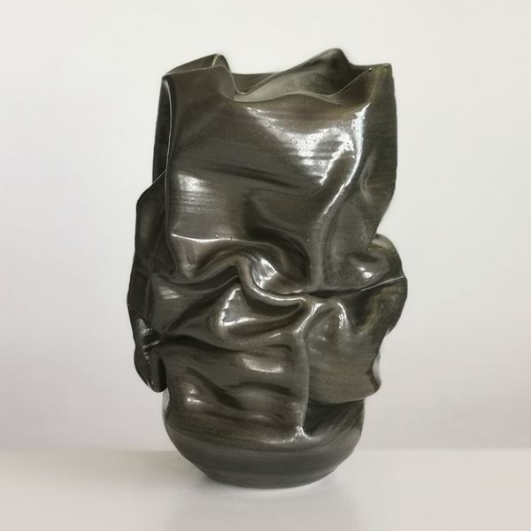 brown leather like crinkled and collapsing handmade ceramic vase