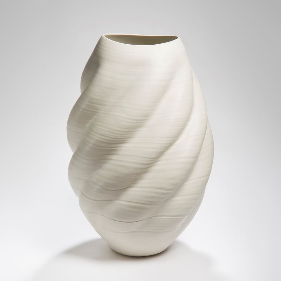 sculptured ceramic vessel vase in cream with ripple effect