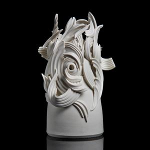 ceramic sculpture in grey of decorative swirls