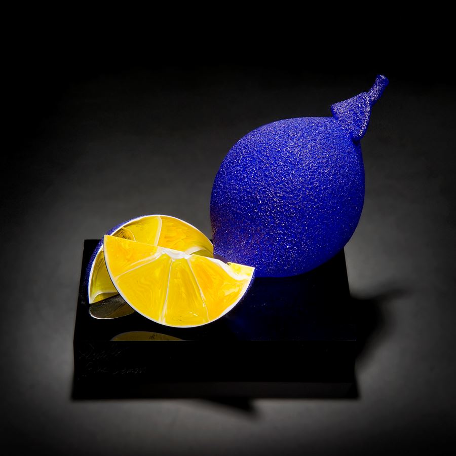 blue and yellow still life glass art sculpture of lemons
