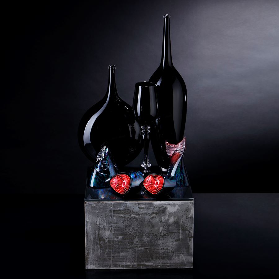 black and red contemporary still life art glass sculpture with vases and cut fish