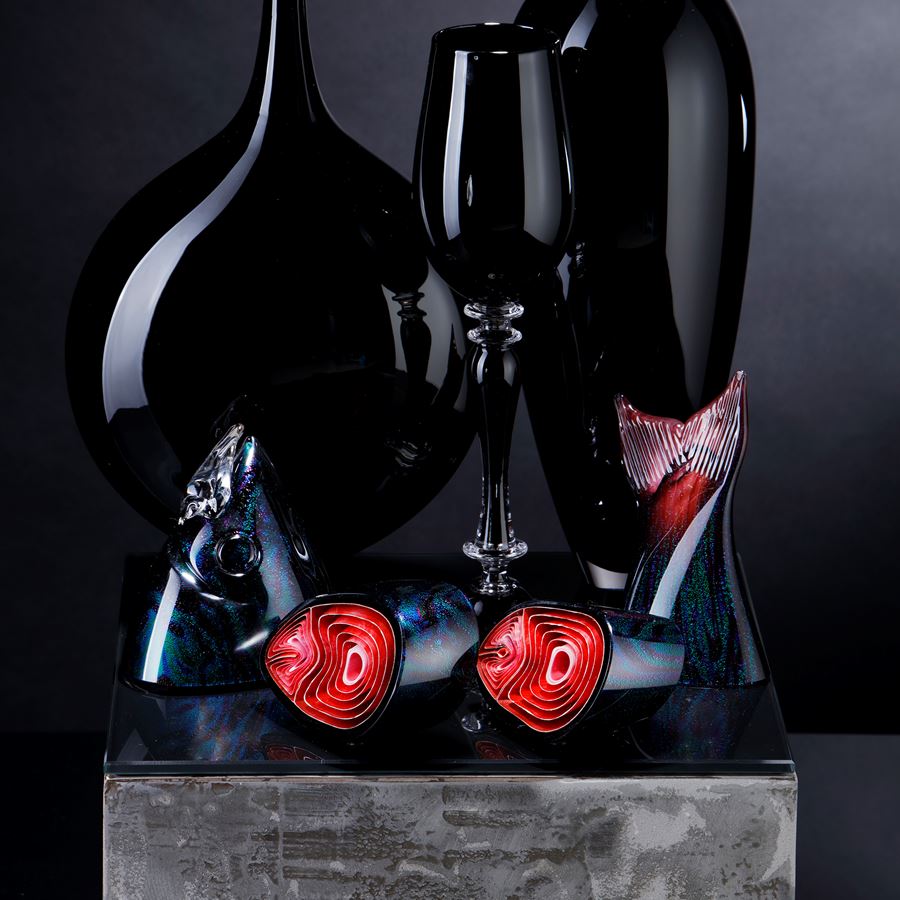 black and red contemporary still life art glass sculpture with vases and cut fish