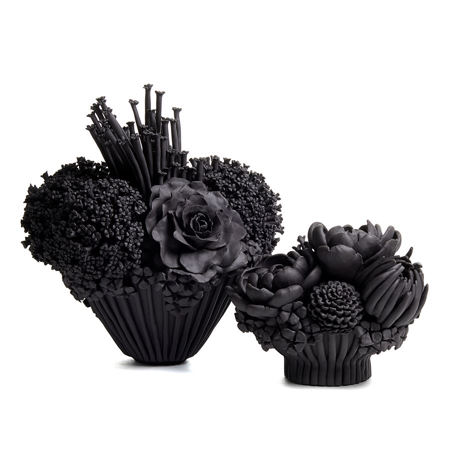 black stoneware sculpted artwork of mixed flowers