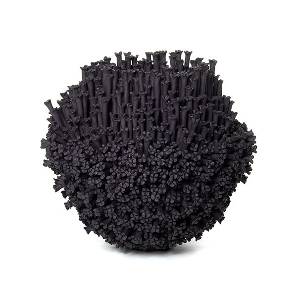 black stoneware sculpted artwork covered in small flowers