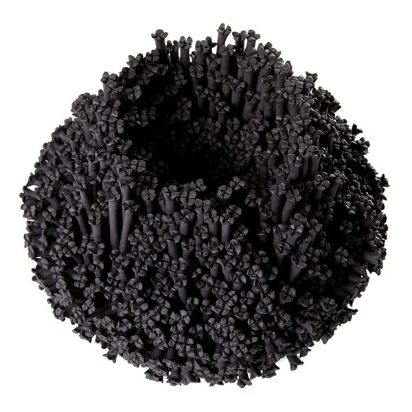 black stoneware sculpted artwork covered in small flowers