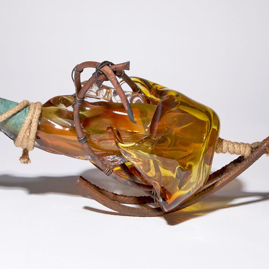 amber and brown contemporary mixed media abstract sculpture made blown glass patinated metal and rope