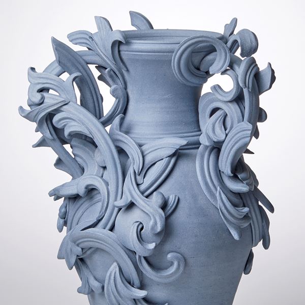 blue ceramic vase with decorative classical trim