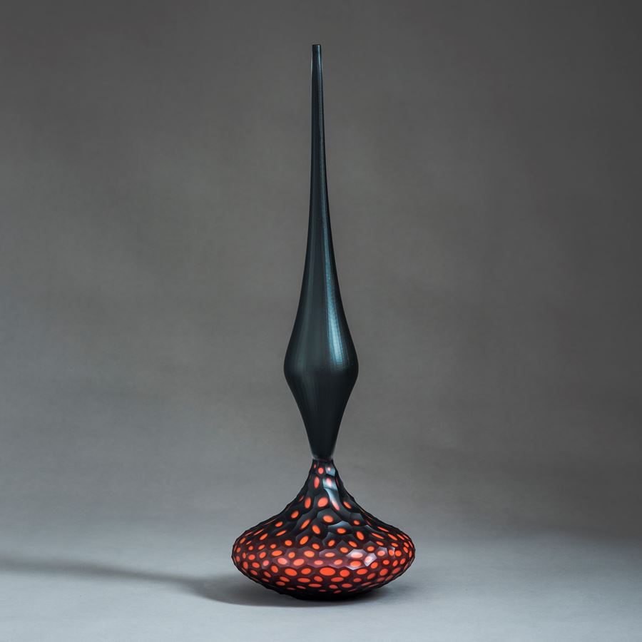 red and black contemporary geometrically patterned set of three sculptures made from handblown and cut glass