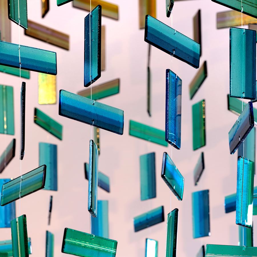 Aqua amber and green contemporary abstract hanging sculpture made from many handmade glass elements