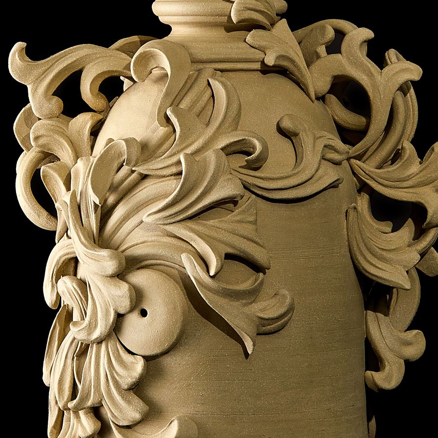 grey decorative stoneware vase sculpture with ornate floral trim