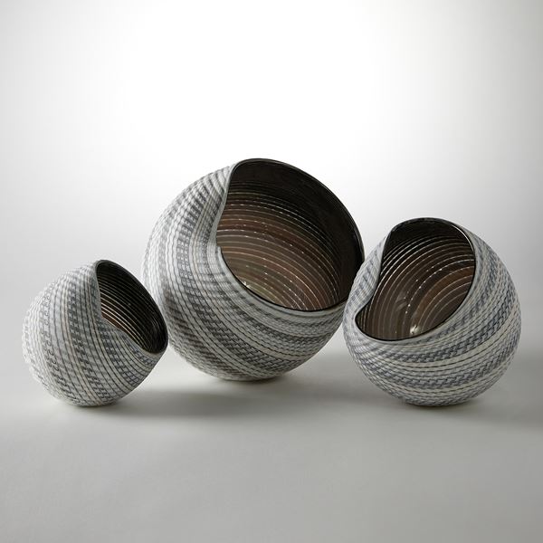 handblown and cut glass contemporary sculptural installation with swirling pattern 