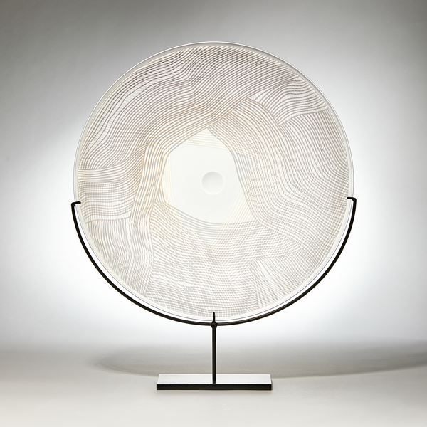 grey gold and clear round sculptural glass plate made from handblown and cut glass with metal stand