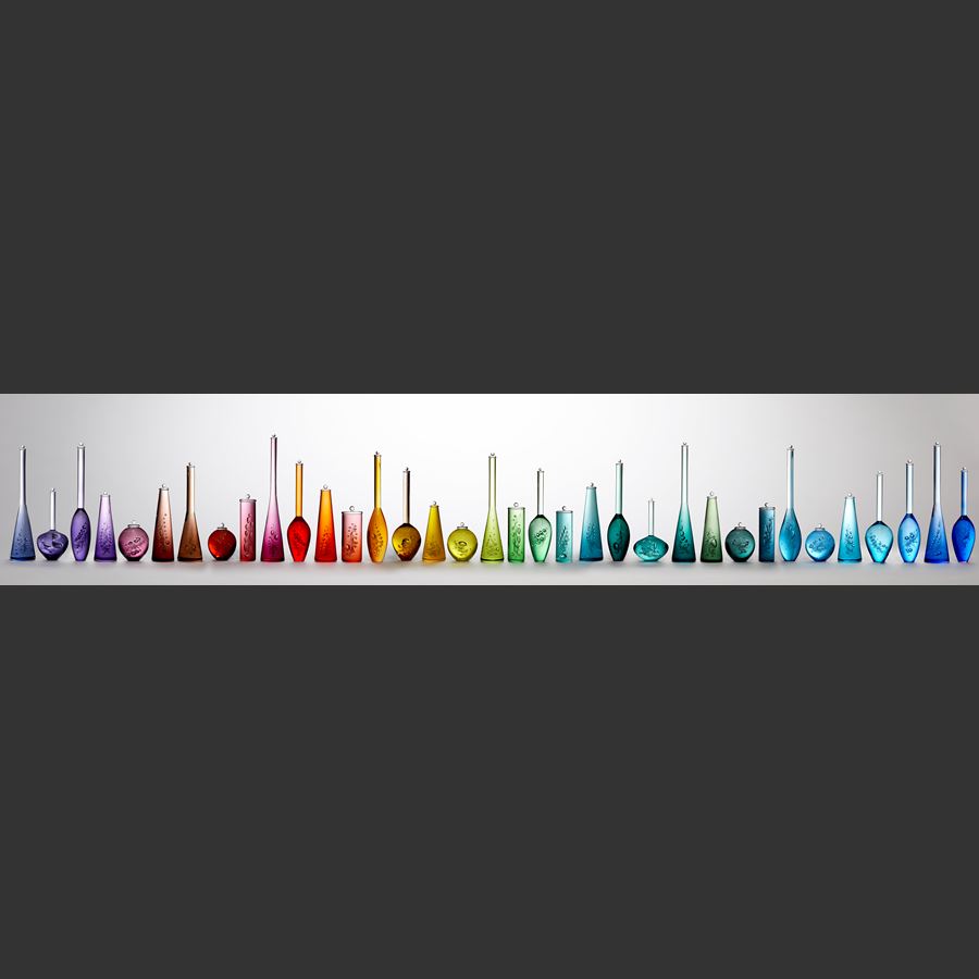 multicoloured scientific bottles installation created from handblown glass