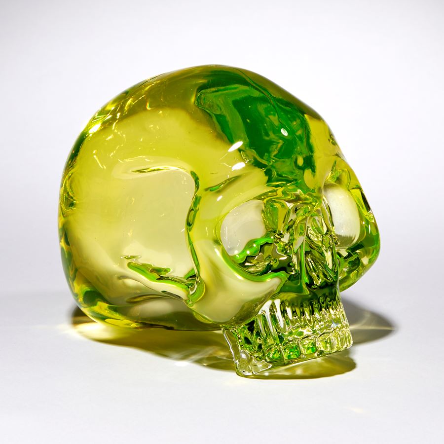 uranium coloured hand sculpted solid glass human skull 
