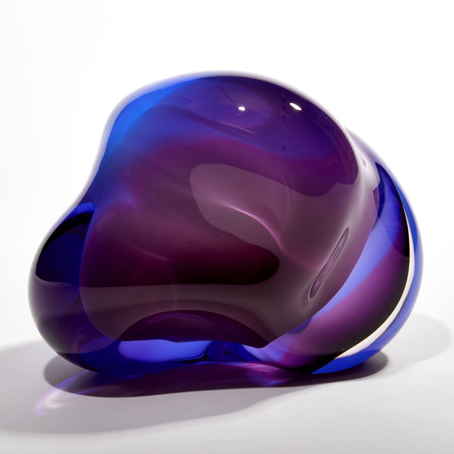 layers of white blue and purple glass create an amorphous handmade sculpture