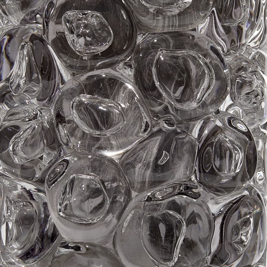 grey and clear cylindrical sculptural glass vase covered in large clear bubbles made from handblown glass with mirrored interior