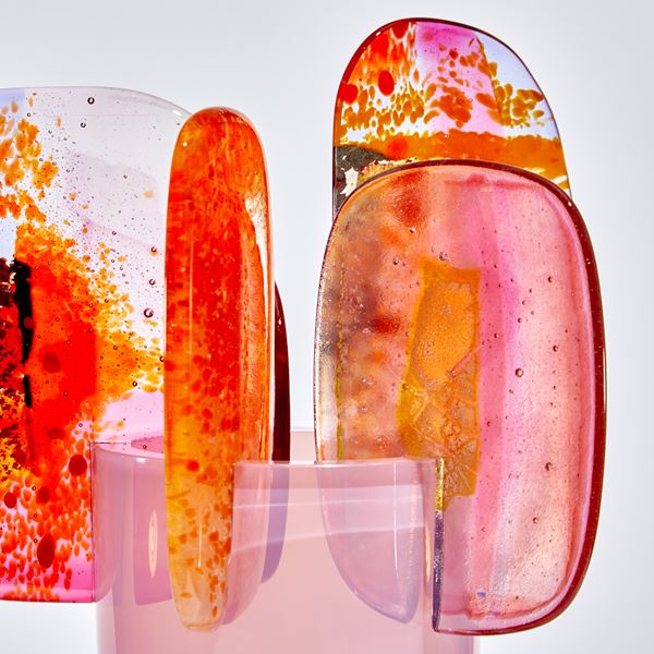 bright pink and orange abstract lollipop style sculpture handmade from glass