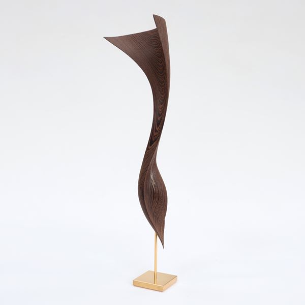 wave like form in wood on gold base handmade with gold detail