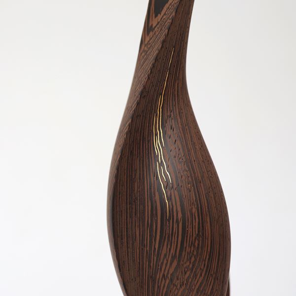 wave like form in wood on gold base handmade with gold detail
